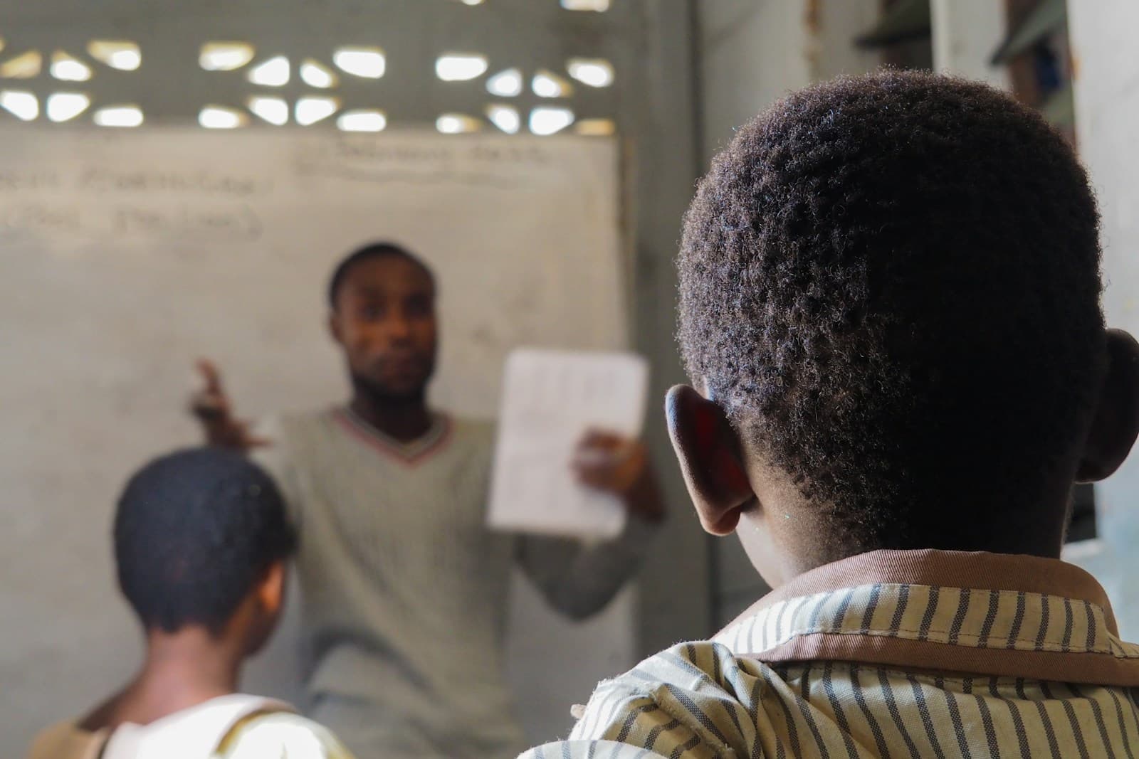 A teacher leading a classroom lesson with students